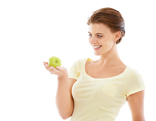 Image showing Diet, health and woman with an apple in a studio for nutrition, wellness and healthy weightloss. Natural, beauty and female model holding a fruit while isolated by white background with mockup space.