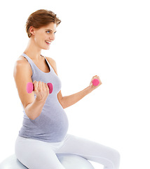 Image showing Woman, pregnancy and exercise ball with dumbbell in studio for fitness, wellness and self care by white background. Pregnant woman, development and isolated workout for future, health and training