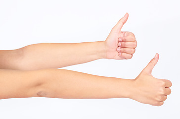 Image showing Thumbs up, success and hands of people for thank you, agreement and like on white background in studio. Winning motivation, yes and emoji hand for yes, happy sign and approval on a studio background