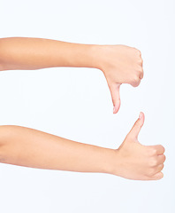 Image showing Hands, thumbs up and thumbs down in yes or no gesture for vote, poll or social media likes on white background. Sign language, finger or hand sign in agreement or disagreement for ASL website review.