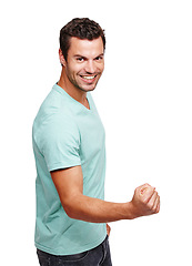 Image showing Portrait, man and fist for success, winning and young guy isolated on white studio background. Male, gentleman and winner with gesture, achievement and victory with smile, celebrate and on backdrop