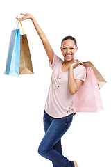 Image showing Shopping bags, fashion and portrait of woman in studio isolated on a white background. Black Friday discount, sales deals and happy female customer holding gifts after buying at mall, store or shop.