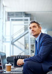 Image showing Thinking, corporate or businessman with laptop for invest strategy, finance growth or financial review. Coffee, focus or manager in airport sofa for travel, data analysis or economy data research