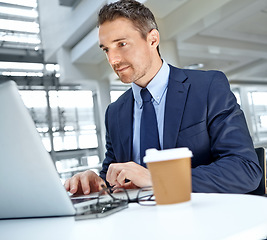 Image showing Laptop, office and businessman working on a report or corporate proposal for the company. Success, technology and professional male employee from Canada doing research for a project in the workplace.