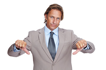 Image showing Businessman, thumbs down and upset in disappointment for failure against a white studio background. Portrait of a isolated business man pointing down thumbs in disapproval, wrong or incorrect gesture