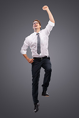 Image showing Business, man and jump for celebration, excited and achievement with company, deal and isolated on studio background. Male entrepreneur, employee or consultant happy, promotion or jumping for target