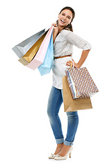 Image showing Portrait, shopping and woman with bags, retail or luxury boutique clothes with client isolated on white studio background. Female, customer or lady with clothes, expensive products or exclusive items