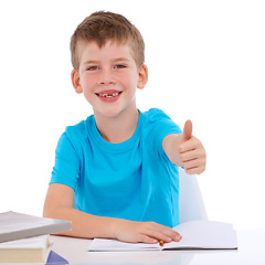 Image showing Thumbs up, learning and child with books in studio education, back to school and knowledge success. Yes, ok and winning hand sign of boy in portrait for writing goals, isolated on white background