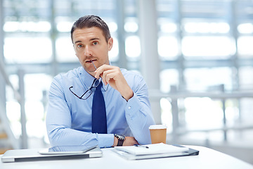 Image showing Portrait, vision and idea with a business man at work by his desk in the office for future growth. Interview, human resources and management with a male employee working on a mission for development