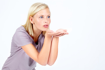 Image showing Flirt, thinking and woman with air kiss contemplating, pondering and thoughtful for advertising. Attractive, flirting and affection of isolated model blowing kisses on white background mock up.