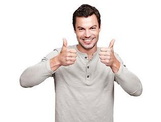 Image showing Portrait, thumbs up and emoji with a man in studio isolated on a white background as a winner or for motivation. Thank you, goal and target with an excited man giving a positive hand sign of support