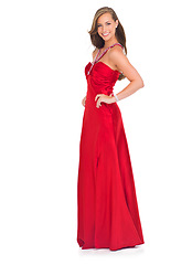 Image showing Elegant, prom and portrait of a woman in a red dress for an event isolated on a white background in a studio. Happy, fashion and model in a silk ball gown for a celebration on a studio background