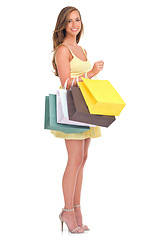 Image showing Portrait, shopping sale with a woman customer in studio isolated on a white background for retail. Sales, fashion and shopping bags with a female inside to shop for a bargain, deal or discount