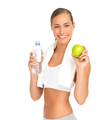 Image showing Studio portrait, woman and water with apple, smile and nutrition for workout goal, health and white background. Isolated model, bottle and fruit diet for healthy training, wellness and strong body