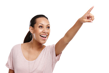 Image showing Woman, happy and excited pointing finger in studio for advertising mockup, marketing promo or sales product suggestion. Happy person, point hands and vision motivation isolated in white background