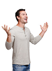 Image showing Happy, smile and man with hands, palms and winning hand gesture in the air white white background. Isolated, model and excited winner sign of a person with open hands looking up and standing vertical
