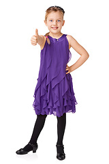 Image showing Portrait, girl and thumbs up for agreement, smile and kid isolated on white studio background. Female child, young person and gesture for success, happiness and winner with dress, goal and motivation