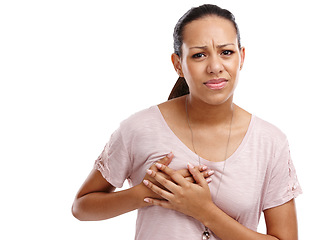 Image showing Woman, breast and cancer holding chest in discomfort, pain or ache against a white studio background. Portrait of isolated young female clutching boobs touching painful area, sore or inflammation