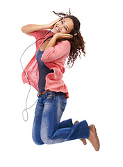 Image showing Portrait, music headphones and woman jump in studio isolated on a white background mock up. Jumping, energy and happy female with hifi headset streaming, listening or enjoying podcast, radio or audio