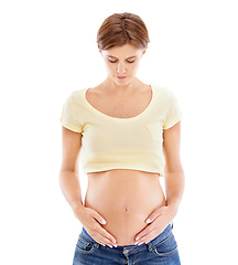 Image showing Pregnant woman, white background and touch stomach, body and maternity for wellness, hope and healthcare. Abdomen, beauty and pregnancy of mother on studio background, skincare or healthy dermatology