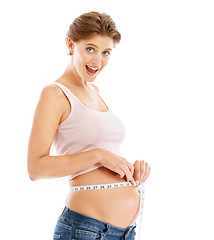 Image showing Portrait of happy pregnant woman with measuring tape on stomach, excited smile on face and white background. Health, wellness and pregnancy, woman measuring growth progress of baby in belly in studio