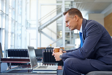 Image showing News, coffee focus and businessman with a laptop for work, communication and internet. Business, working and man reading email, information and corporate chat on a computer with tea in an office