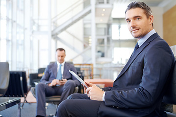 Image showing Corporate, portrait or businessman with tablet in office building for communication, networking or blog news. Focus, travel or manager in airport with technology for social media or social network