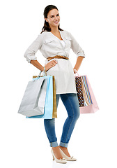 Image showing Portrait, shopping or sale with a woman customer in studio isolated on a white background for retail. Fashion, deal and sales with an attractive young female consumer or shopper looking for a bargain