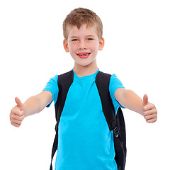 Image showing Boy, portrait smile and thumbs up for school, education or learning against a white studio background. Young happy face of isolated casual child student with thumbsup, backpack or school bag