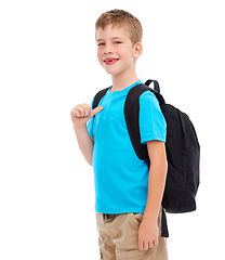 Image showing Backpack, happy and boy child in a studio with a casual, cool and natural outfit for back to school. Happiness, smile and portrait of a kid with a bag and stylish clothes isolated by white background