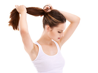 Image showing Hair, beauty and mockup with a woman in studio isolated on a white background for natural or keratin treatment. Haircare, cosmetics and tying with a young female posing to promote her hairstyle