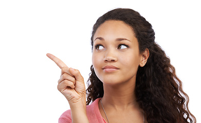 Image showing Young black girl, point and thinking suggestion for advertising mockup, marketing and branding in white background. Person, happy face and pointing, happiness and product placement space in studio