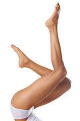 Image showing Skincare, wellness and legs of woman on a white background for shaving, grooming and waxing. Cleaning, beauty and pedicure of girl isolated in studio for laser treatment, cosmetics and hair removal