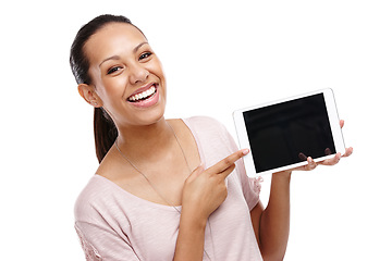 Image showing Portrait, pointing and woman with tablet mockup in studio isolated on a white background. Face, marketing and happy female holding touchscreen technology for product placement or advertising space
