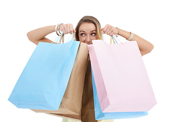 Image showing Shopping, bags and retail with a woman customer in studio on a white background for a sale, discount or bargain deal. Brand, gift and product with a female consumer carrying shopping bags for sales