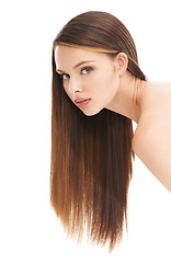 Image showing Portrait, hair and beauty with a model woman in studio on a white background with a straight hairstyle. Salon, haircare and growth with an attractive young female posing to promote keratin treatment