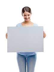 Image showing Woman, poster and smile for marketing, advertising or branding against a white studio background. Happy isolated female model holding billboard for message, brand or advertisement on white background