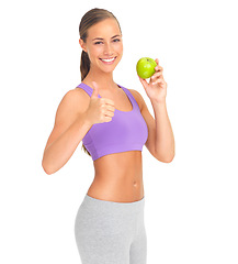 Image showing Woman, studio portrait and apple with thumbs up for health, diet goal or wellness by white background. Isolated model, healthy fruit or smile for nutrition, vitamin c or natural detox for strong body