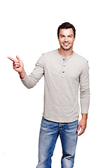 Image showing Man, studio and portrait while pointing finger at space for advertising isolated on a white background. Happy male model from France with hand sign for promotion, announcement and brand product