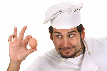 Image showing young funny chef with egg