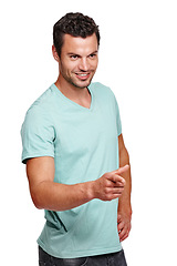 Image showing Handsome man, smile and pointing finger while standing against a white studio background. Isolated attractive happy male model posing and smiling while showing direction on a white background