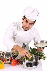 Image showing young chef preparing lunch