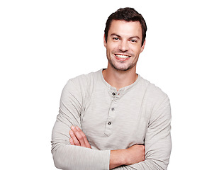 Image showing Man, smile and arms crossed with teeth and vision for happy ambition, goals or profile against white studio background. Portrait of a isolated young male smiling with crossed arms on white background