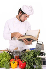 Image showing young chef preparing lunch