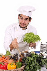 Image showing young chef preparing lunch