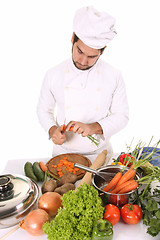 Image showing young chef preparing lunch