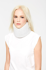 Image showing Woman with neck injury, medical brace in studio and neck pain portrait, health insurance isolated on white background. Health, accident and whiplash with recovery, pain and neck brace for healthcare