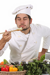 Image showing young chef smelling