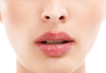 Image showing Woman face, skincare or lips with makeup cosmetics, mouth dermatology or healthcare wellness on white background. Zoom, beauty model and macro of facial lip gloss product for collagen hydration glow