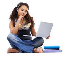 Image showing Student, laptop and studying with books or thinking in studio for university education, knowledge and internet research. Young black woman, learning or reading college online notes on tech device